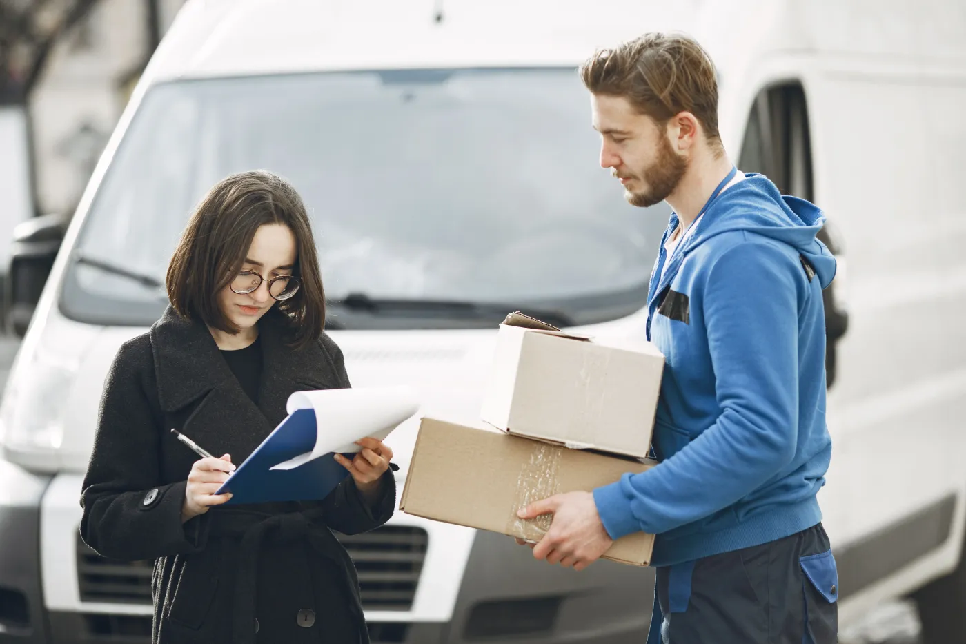 Courier obtaining a signature for a delivered package